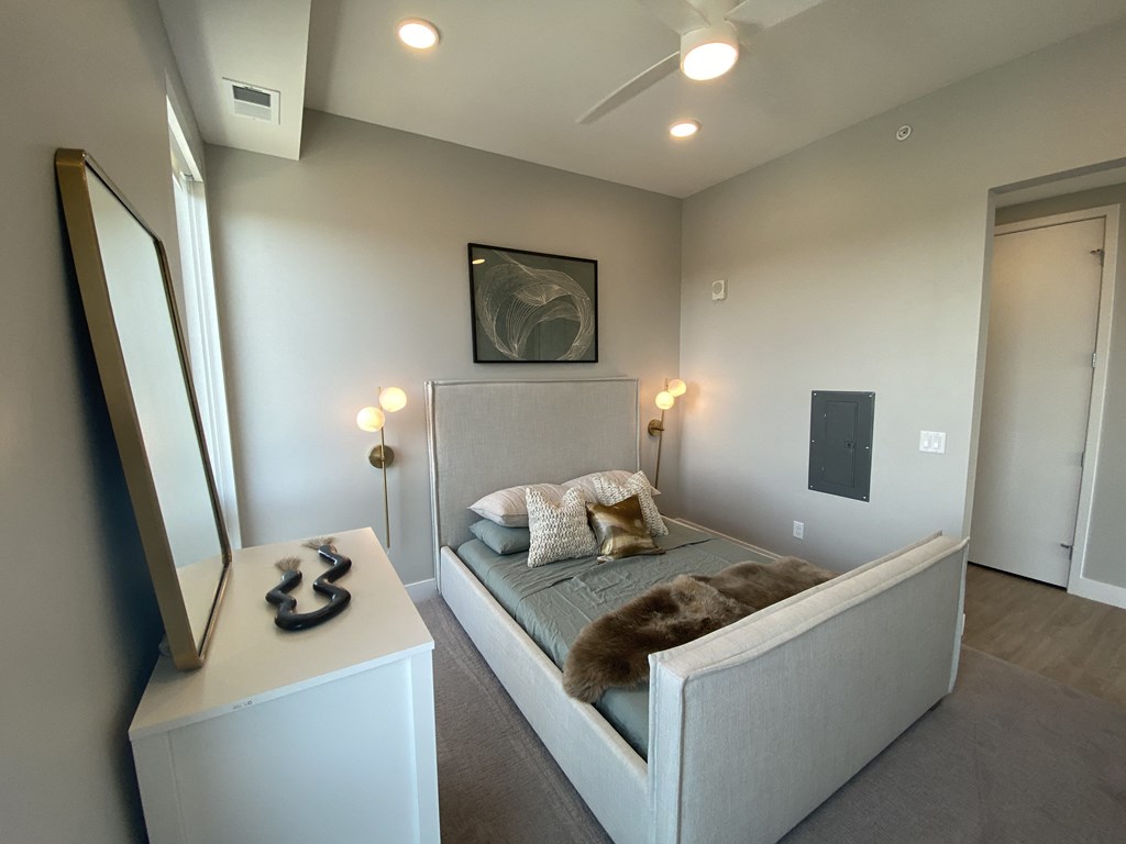 a bedroom with a bed in a room
