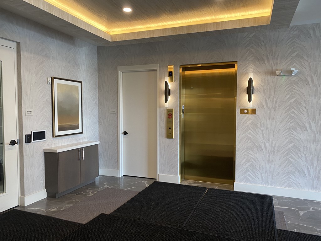 a view of the elevators in the lobby