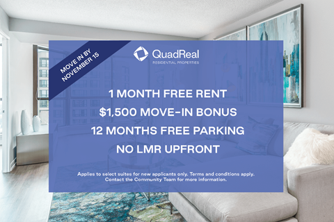 A room with a couch and a poster advertising a free rent bonus.