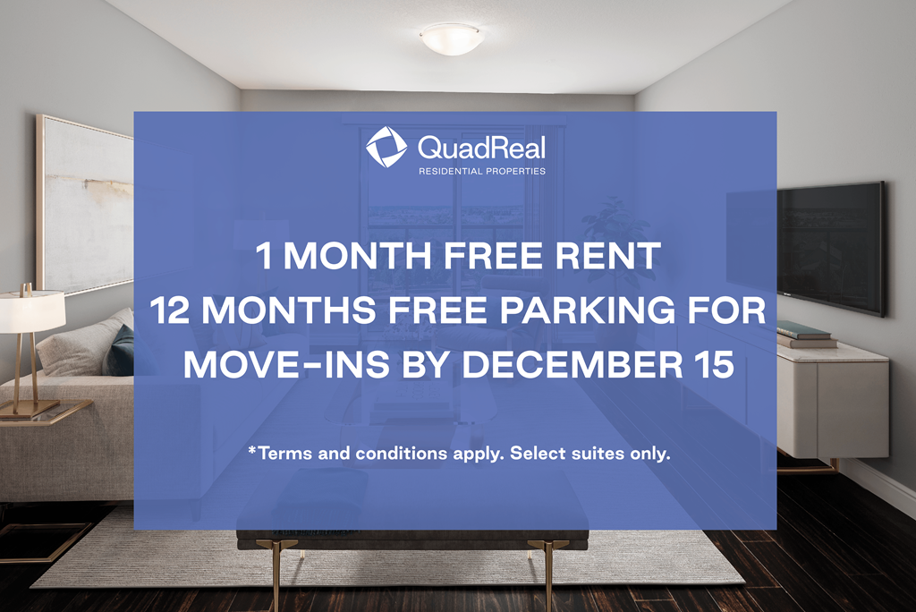 A room with a QuadReal residential properties sign offering free rent and parking for move-ins by December 15.