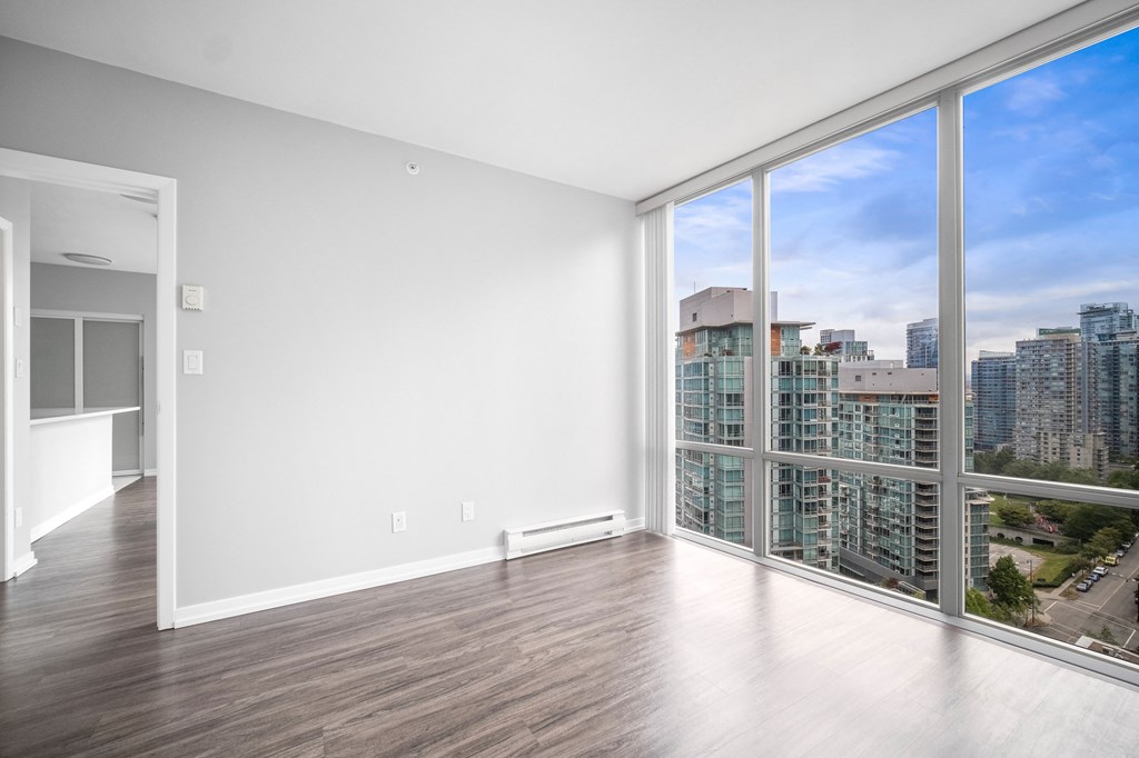 Floor to ceiling windows offer stunning views of the surrounding area.