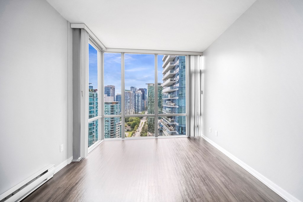 Floor to ceiling windows offer stunning views of the surrounding area.