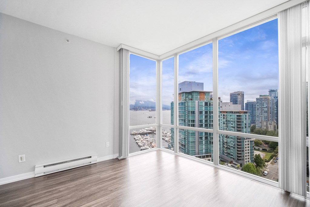 Floor to ceiling windows offer stunning views of the surrounding area.