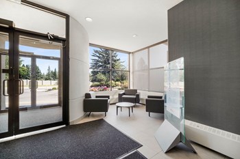 lobby and nook area with grey chairs - Photo Gallery 3