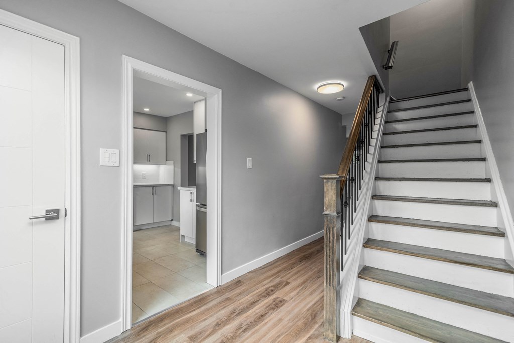 Suite entry with opening to kitchen