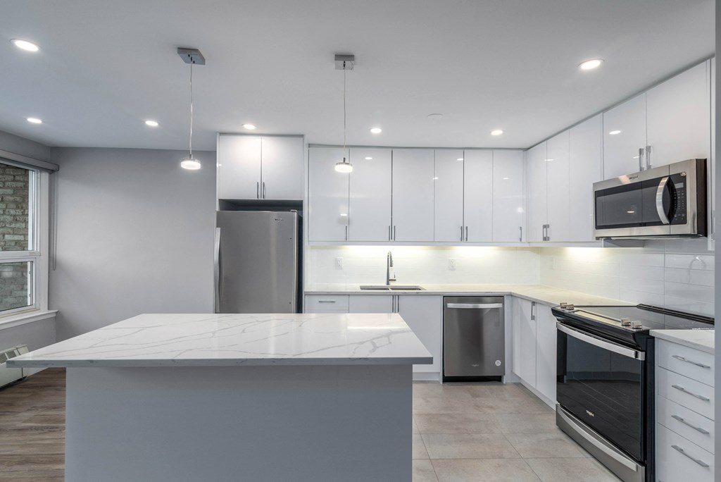 Bright kitchen with white cabinets