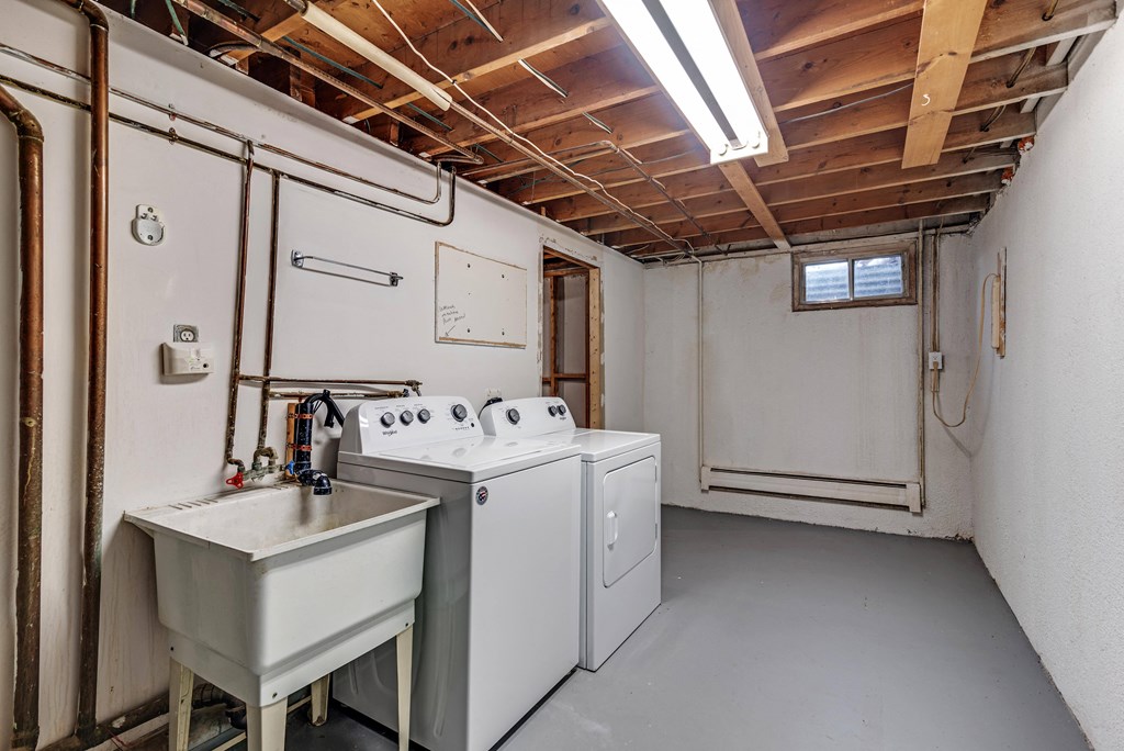 Lower level with washer, dryer and washing basin