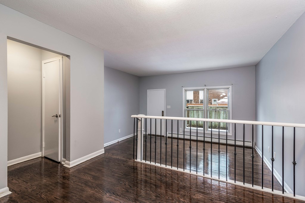 Dining room and living room separated by a step