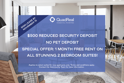 A sign in a room advertising a $500 reduced security deposit for 2 bedroom suites.