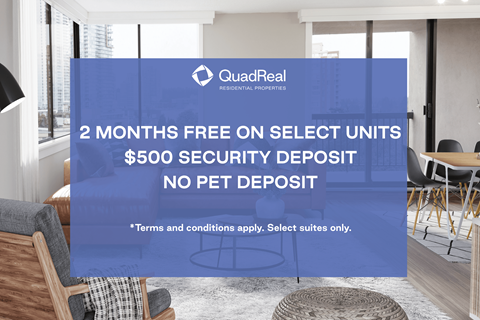 A room with a QuadReal sign offering 2 months free on select units.
