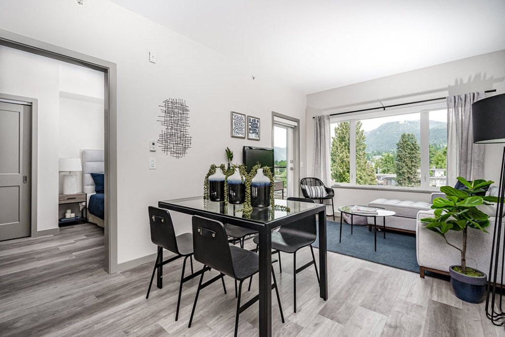 a dining room with a table and chairs