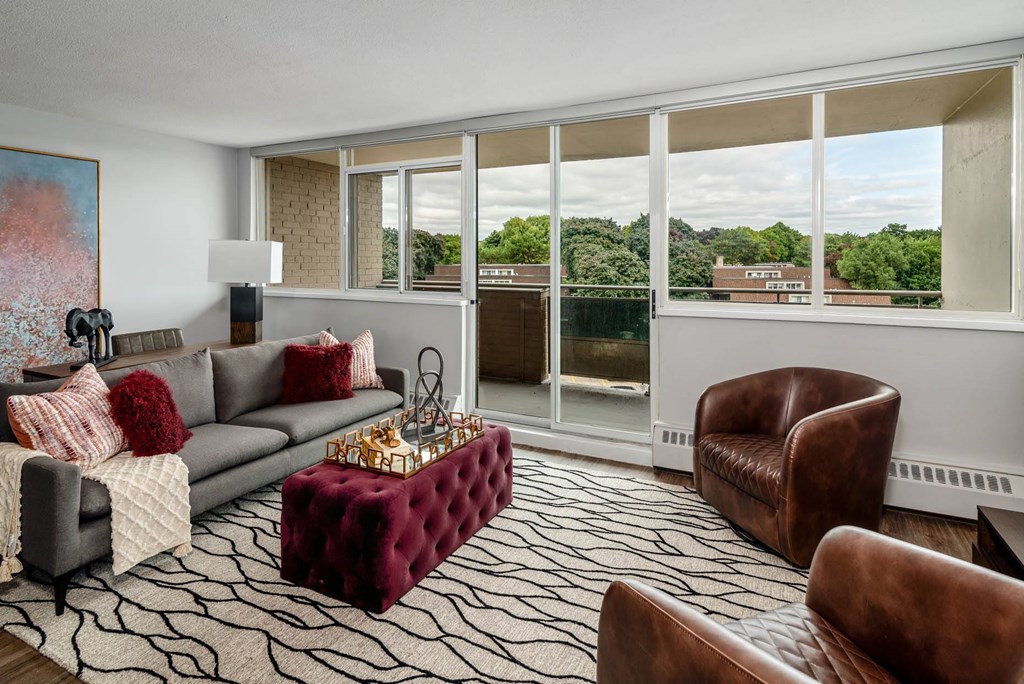 a living room with a couch and a large window