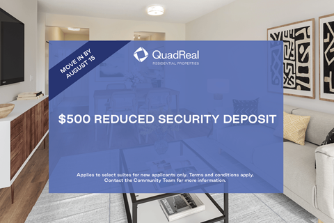 A sign advertising a $500 reduced security deposit from QuadReal.