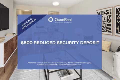 A sign advertising a $500 reduced security deposit from QuadReal.