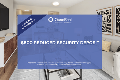 A sign advertising a $500 reduced security deposit from QuadReal.