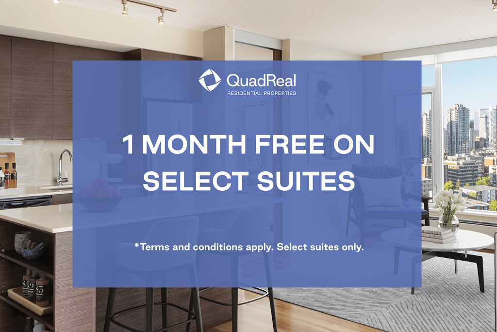 A kitchen interior with a large window overlooking a cityscape, with a promotion for QuadReal Residential Properties offering 1 month free on select suites.