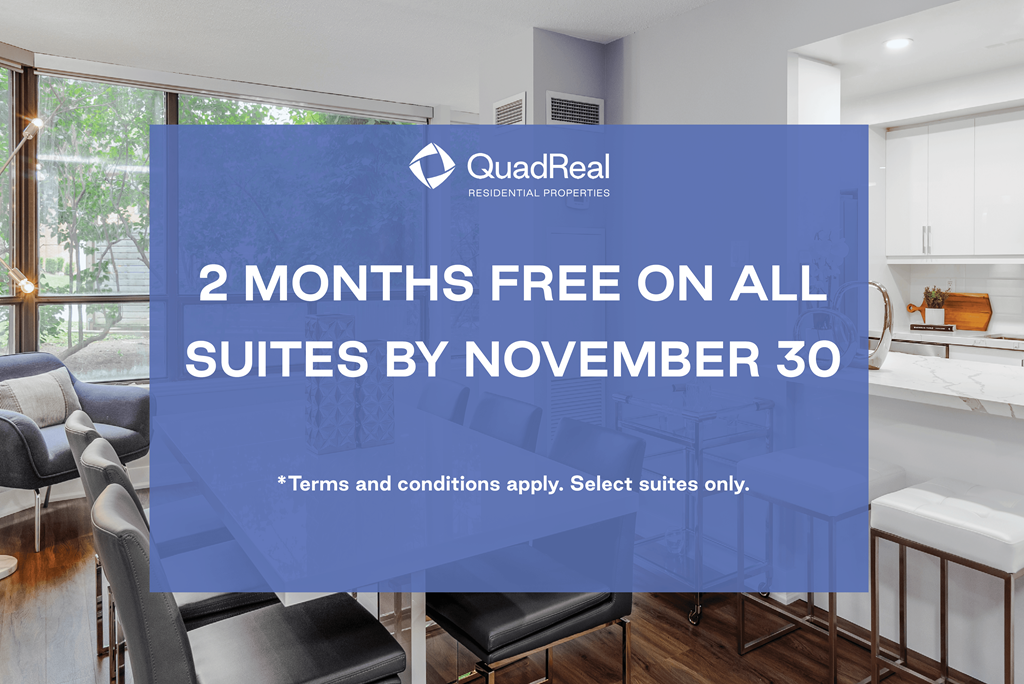 A room with a QuadReal sign offering 2 months free on all suites by November 30.