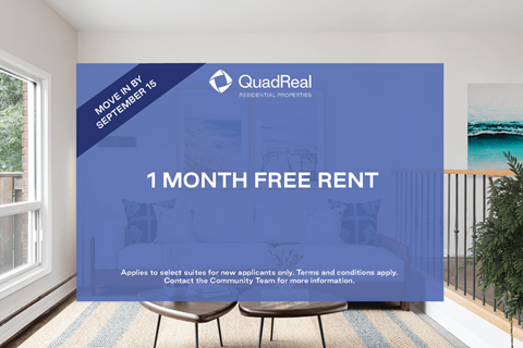A room with a QuadReal advertisement for a free one month rent.