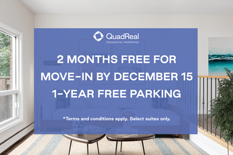 A room with a QuadReal sign offering free move-in and parking.