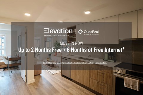 A modern kitchen interior with a promotion for free internet from QuadReal Residential.