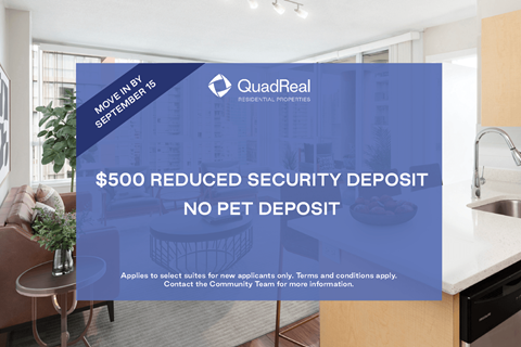 A sign in a kitchen advertises a $500 reduced security deposit for new applicants.