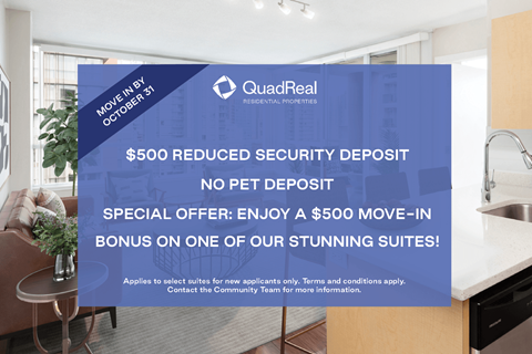 A sign advertising a $500 reduced security deposit for new applicants at QuadReal.