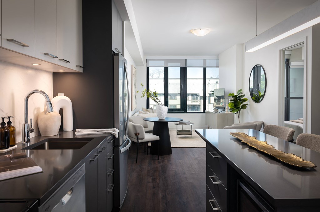 a kitchen and living room in an apartment
