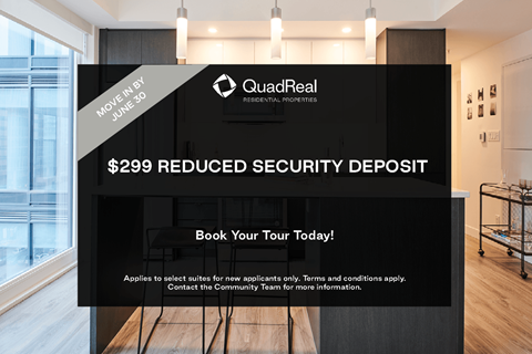 A sign advertising a $299 reduced security deposit for QuadReal Residential Properties.