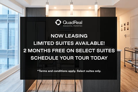 A sign advertising QuadReal's leasing of limited suites with a 2 months free offer.