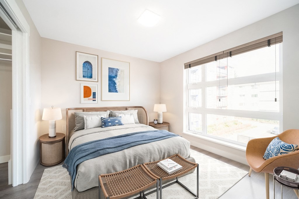 Staged bedroom with queen-sized bed and stunning view.