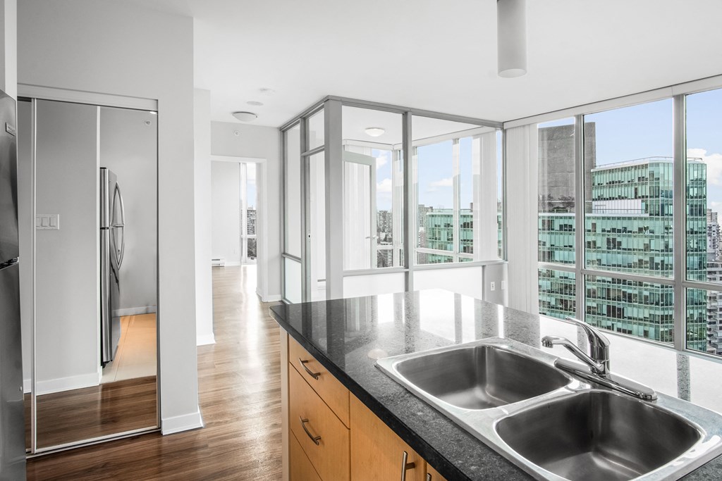 View looking left from the kitchen of 2308, floor-to-ceiling windows ensure tons of natural light.