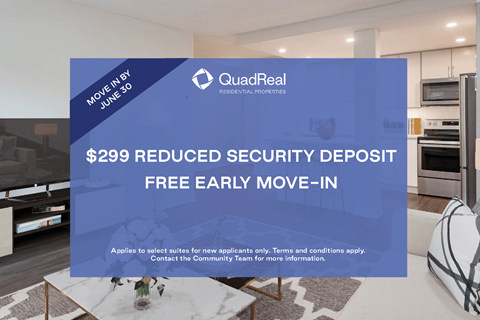 A living room with a QuadReal advertisement for a reduced security deposit.