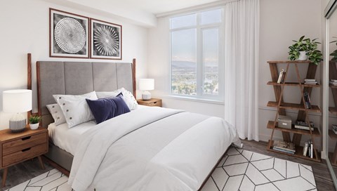 a bedroom with a large bed and a window