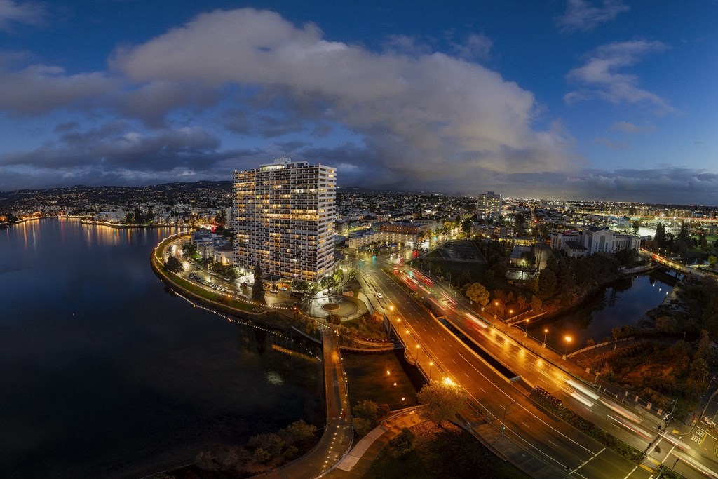 a night view of the city from the roof of a building