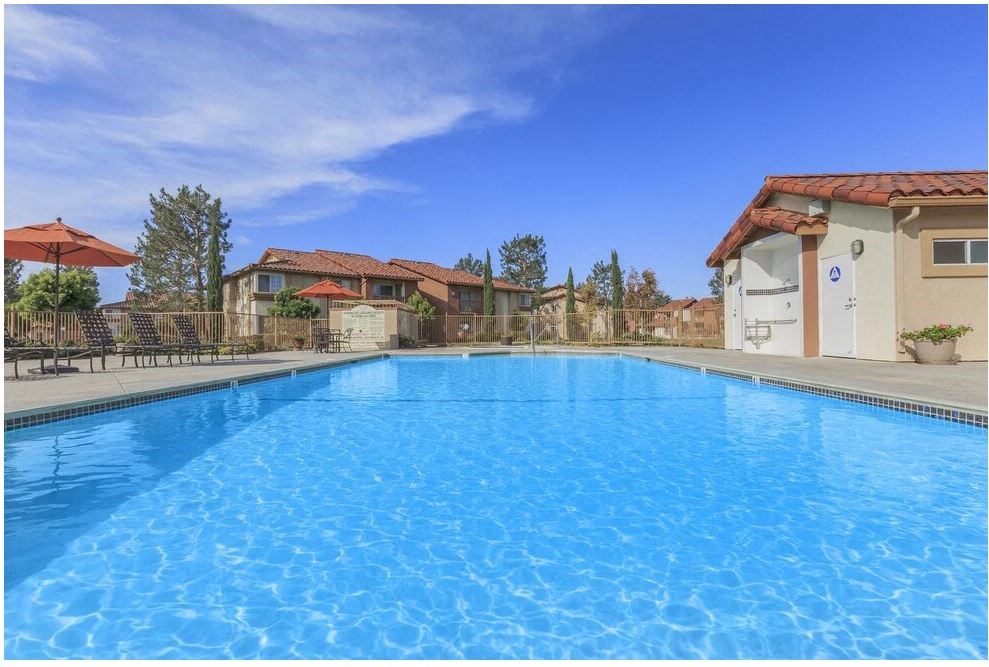 a large swimming pool with houses in the background at Riverview Springs, Oceanside