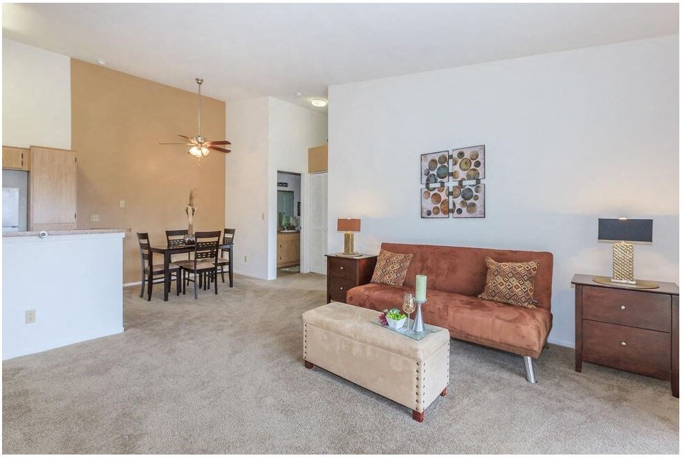 a living room with a couch and a table at Riverview Springs, Oceanside, California