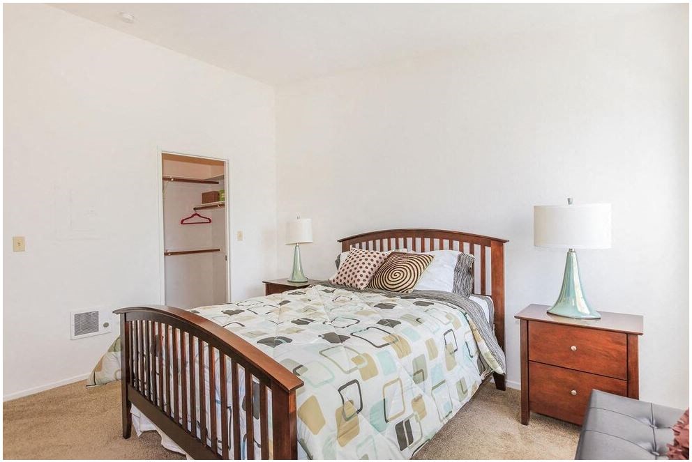 a bedroom with a bed and two night stands at Riverview Springs, Oceanside