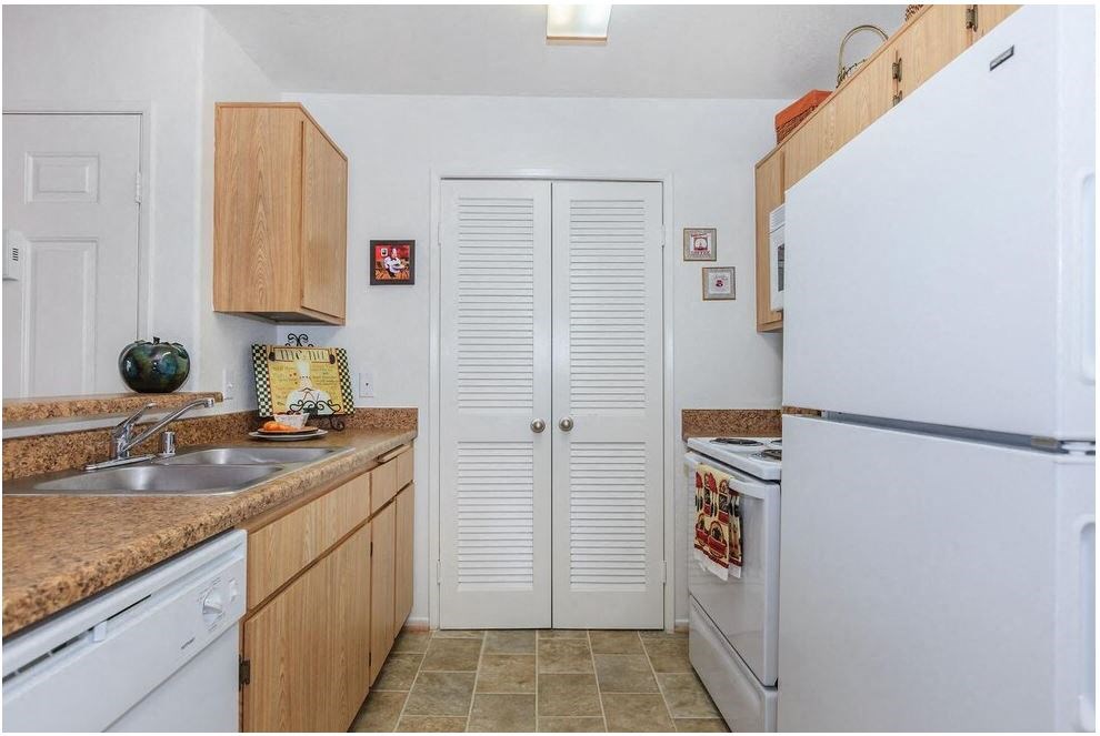 a kitchen with a white refrigerator and a sink at Riverview Springs, Oceanside, CA,92058