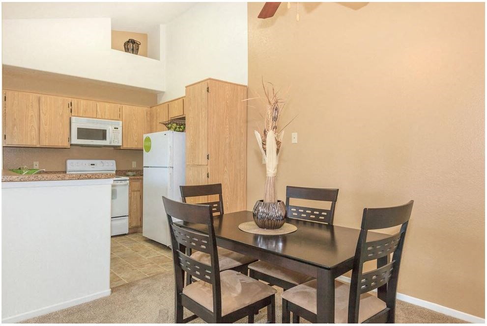 a kitchen and a dining room with a table and chairs at Riverview Springs, California