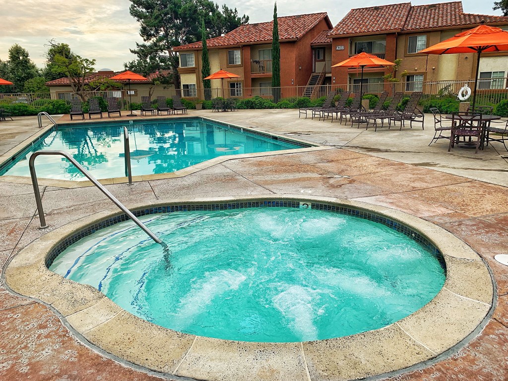 a swimming pool with a hot tub and a resort style pool at Riverview Springs, Oceanside, CA