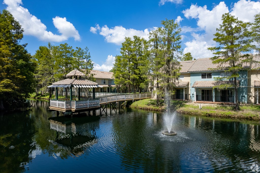 a pond with a fountain at Saratoga Resort Villa Apartments, Kissimmee