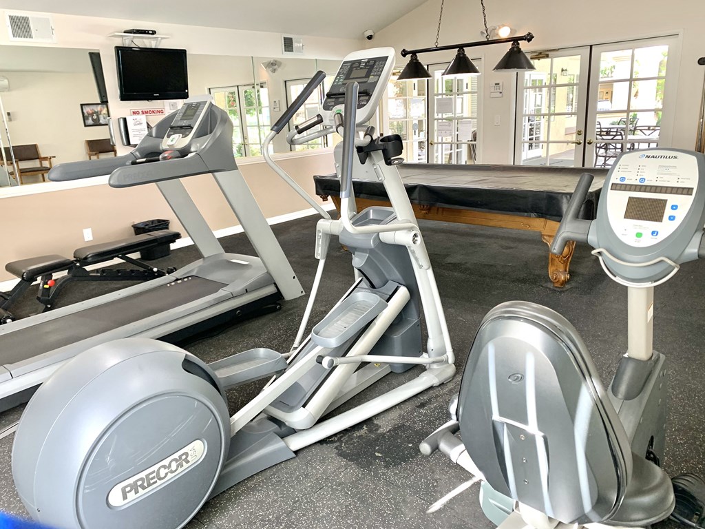 a gym with treadmills and other exercise equipment in a wellness center at Victoria Springs, Riverside, 92504