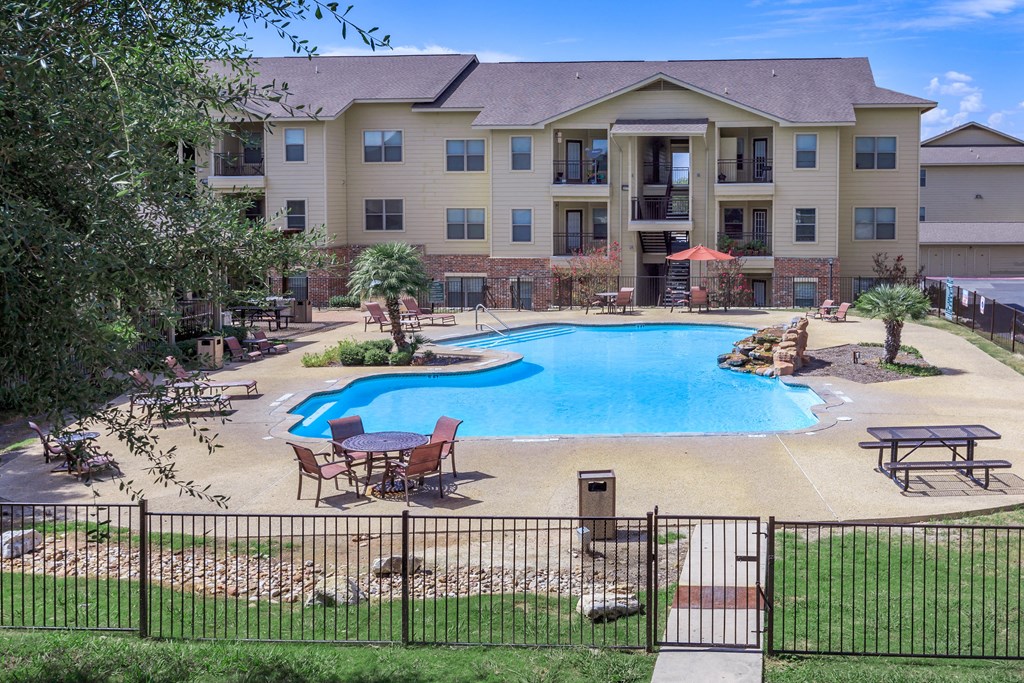 our apartments have a large pool for residents to enjoy at The Villages at Lost Creek, San Antonio Texas