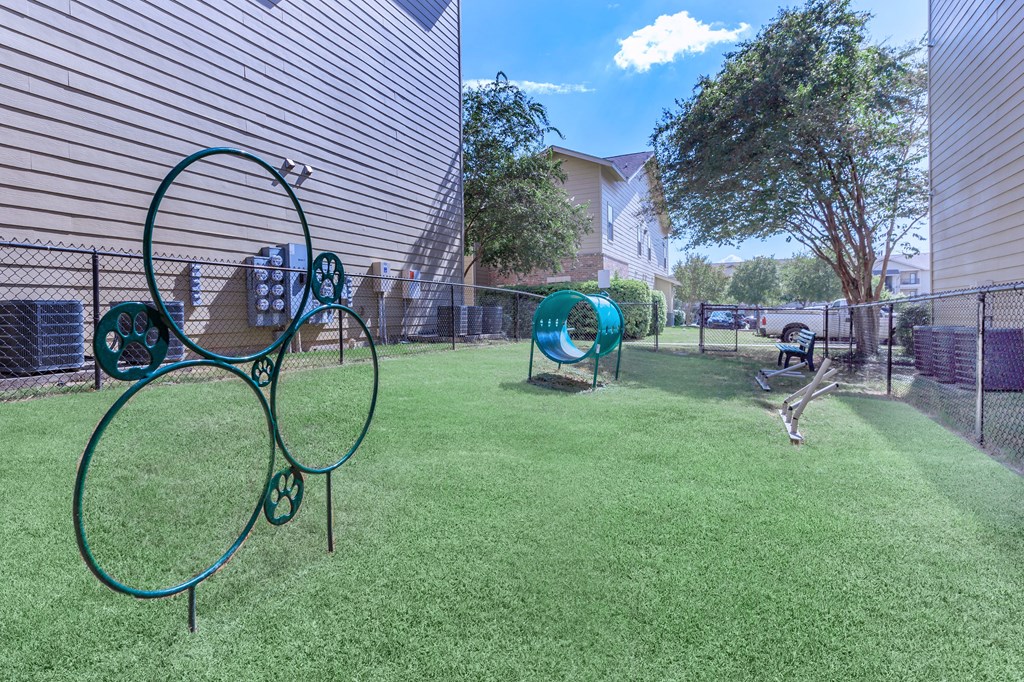 our dog park has a playground and agility equipment at The Villages at Lost Creek, Texas