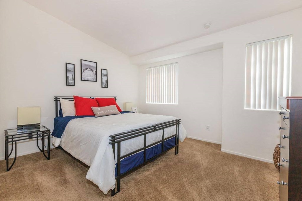 a bedroom with a bed and a closet at Riverview Springs, Oceanside, CA