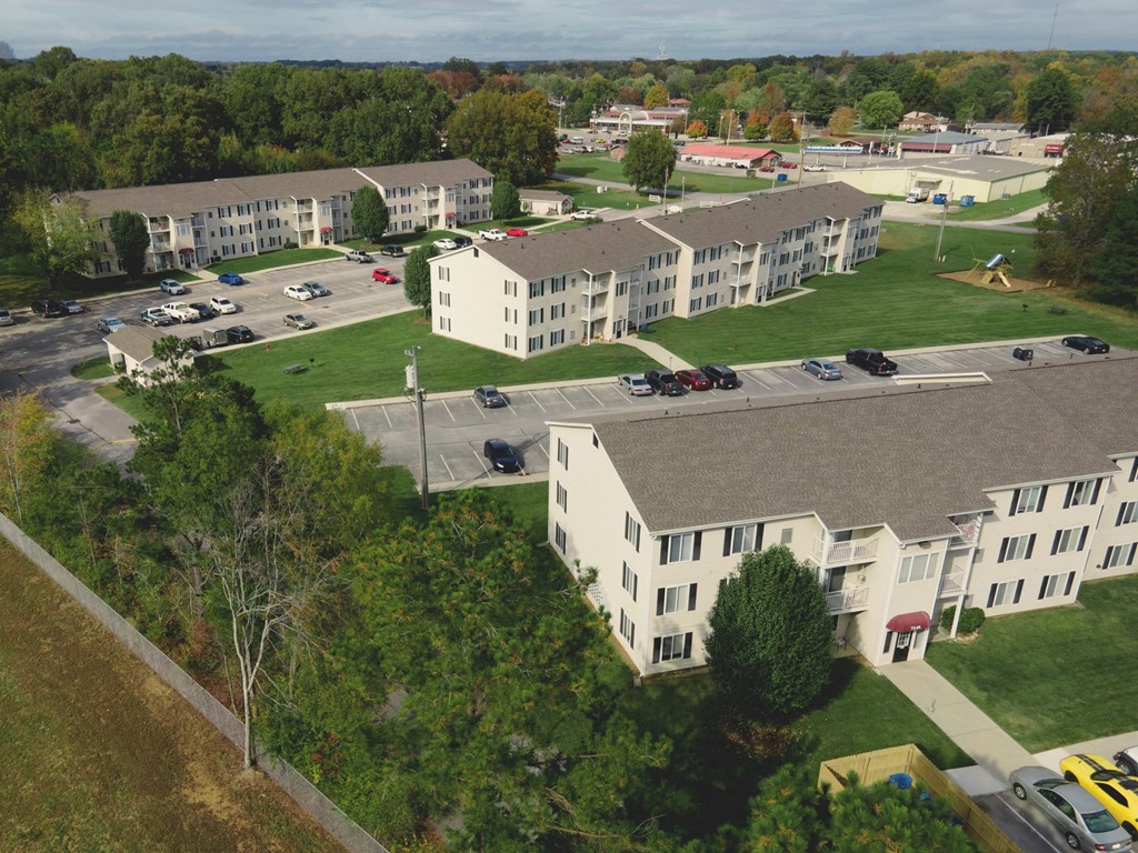 an aerial view of the campus with several buildings and a parking lot