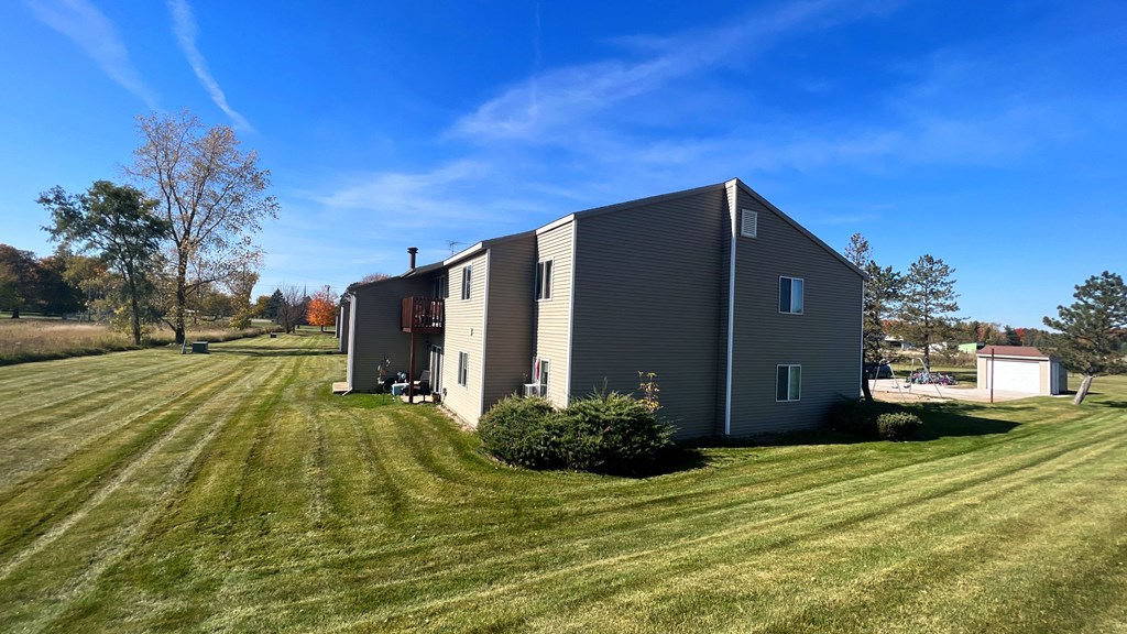 a house with a yard and a blue sky