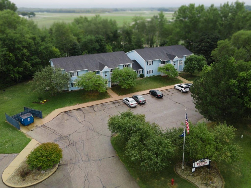 an aerial view of a house and parking lot