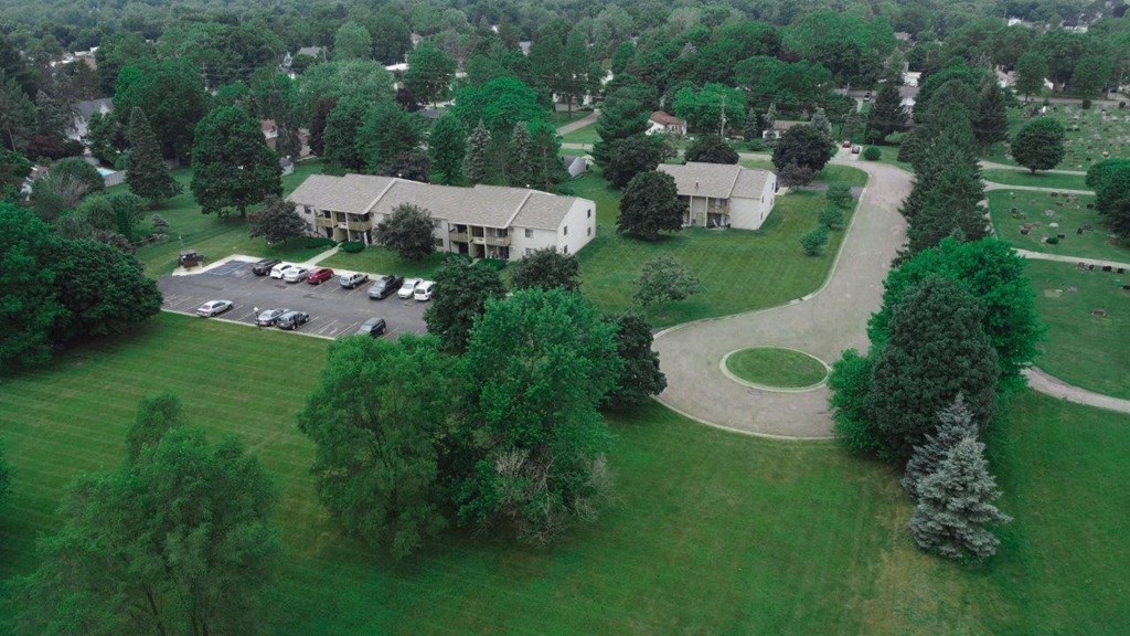 an aerial view of the house and yard from the sky