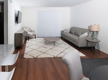 Living Room Living Room with Plank Flooring at Gray Estates Apartments, MRD Conventional, St Clair MI 48079 - Photo Gallery 3